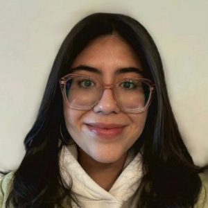 Woman with brown hair and glasses