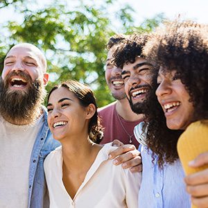 Group of adults outside smiling