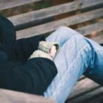 Teen on park bench